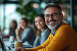 © MastersedZ - Smiling Man in Yellow Sweater Participates in Creative Meeting