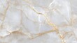 © siriporn - A seamless marble texture background in soft beige and gold tones