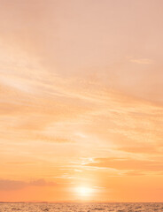 Wall Mural - sunset sky vertical in the evening with orange, pink sunrise on clouds fluffy over sea, beautiful go