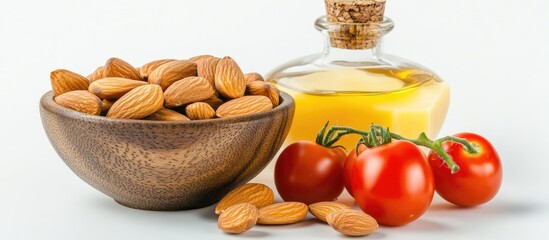Aufkleber - Almonds in a wooden bowl with cherry tomatoes and almond oil alongside against a clean white background, showcasing healthy traditional food elements.