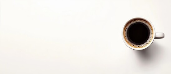 Fototapete - Black coffee in a white cup placed on the left edge of a light white background with an ample blank space for text and design elements.