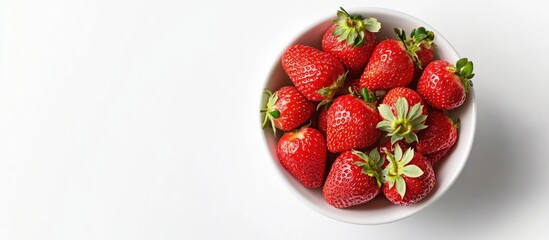 Poster - Fresh red strawberries in a white bowl positioned centrally against a white background, showcasing vibrant green leafy tops.