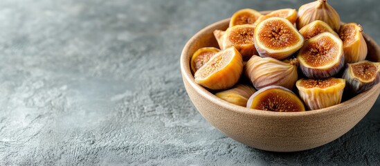 Poster - Bowl of dried figs on a textured grey background with the figs arranged prominently on the left and ample space for text on the right