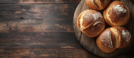 Aufkleber - Golden-brown buns arranged on a wooden board, with a dark rustic surface and a clear left area for text or branding visuals.