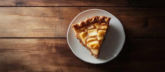 Poster - Slice of charlotte apple pie on white saucer positioned on dark walnut table with warm tones and natural lighting showcasing the pie's texture