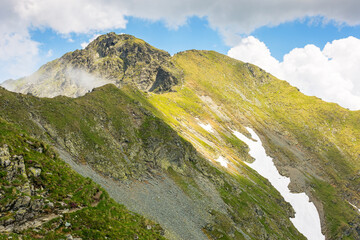 Wall Mural - landscape of fagaras mountains in summer. beautiful nature scenery of romania. steep slope, grassy h