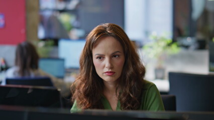 Poster - Thoughtful manager working computer open space office closeup. Woman looking pc