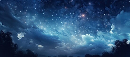 Wall Mural - Starry night sky with deep blue hues and scattered bright stars, framed by dark cloud silhouettes along the bottom, creating a serene atmosphere.