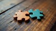 © Mali - Two Interlocking Puzzle Pieces on Rustic Wooden Surface Representing Connection and Collaboration