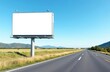 Empty roadside billboard on a long straight highway. Open landscape, clear blue sky, and passing vehicles create a perfect outdoor advertising mockup.