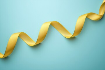 Poster - soft yellow ribbon on light blue background, perfect for decoration.