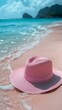 © Saiphon - Summer accessories of minimal pastel summer background with sun hat, sun hat summer background, sandy surface summer background leaving the left area empty for text placement.