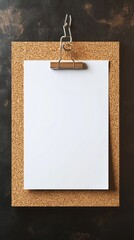 Poster - A clean, white sheet waits on a cork board, held securely by a sleek clip. Its emptiness sparks thoughts and ideas, beckoning creativity in a tidy and minimal workspace