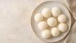 © KHF - A top-down view of mochi, a traditional Japanese dessert, placed on a table.