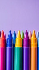 Poster - Colorful crayons standing in a row creating a vibrant pattern on a purple background, perfect for artistic and educational projects