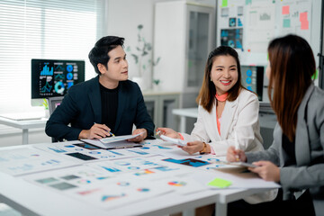 Poster - Marketing team analyzing diagrams and graphs during a meeting
