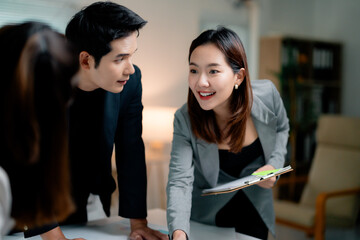 Poster - Asian businesspeople discussing and working together in modern office