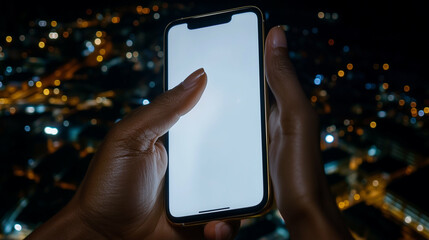 Poster - Smartphone in hand at night shows mobile device with blank screen over city lights view person using mobile phone at night with city bokeh lights in background