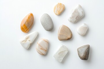 Poster - serene composition of polished decorative stones scattered on pristine white background with ample copy space