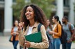 © miss irine - Cheerful black girl student with group of diverse young adults. African american woman with curly afro hair holds book folder, smiles. Multiethnic students friends laugh, look at side, study at