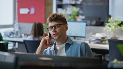 Poster - Sales professional speaking mobile phone client at contemporary office closeup