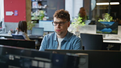 Poster - Tired guy looking computer taking break closeup. Office manager stretching body