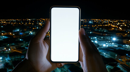 Poster - Smartphone in hands at night showcasing mobile phone technology against city lights backdrop. Mobile phone held up displaying technology with city lights in background at night