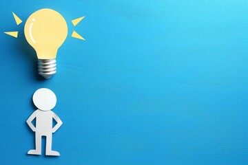 Fototapete - Paper human figure with light bulb and blocks on blue wooden background. Coaching concept