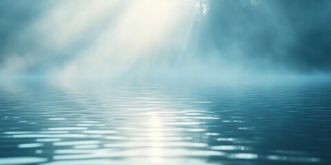 Poster - Gentle ripples disturb the tranquil surface of a lake as sunlight filters through a thick fog, creating a serene and ethereal atmosphere