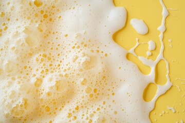 Poster - Close-up macro photography captures the intricate details of beer foam creating mesmerizing patterns on a vibrant yellow background