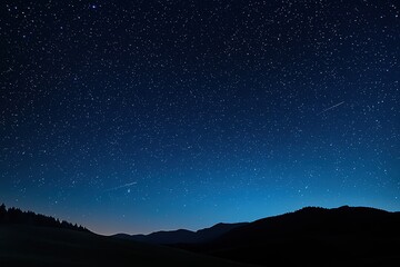 Wall Mural - shooting stars streaking across a vibrant blue night sky create a stunning display above a tranquil 