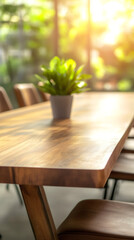 Poster - Empty wooden table adorned with a vibrant plant, basking in warm sunlight within a stylish modern dining room, creating a cozy atmosphere