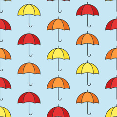 Wall Mural - Yellow, red and orange umbrellas on blue background. Autumn vector seamless pattern.