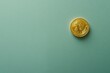 © Vladimir - Bitcoin crypto gold single coin depicted on a green teal background, with area for text. Popular cryptocurrency banner