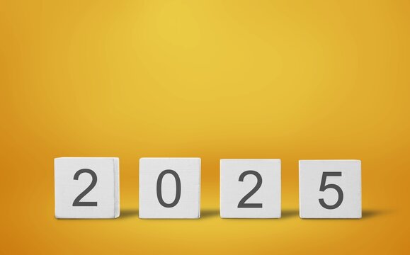 From 2024 to 2025 numbers on wood cubes