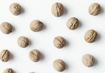 Poster - A collection of whole walnuts arranged neatly on a clean white surface showcasing their natural texture and color : Generative AI
