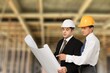 © BillionPhotos.com - Structural engineer and architect worker discuss plan working