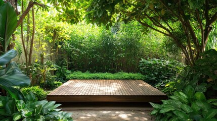 Poster - A peaceful garden with a wooden platform as a focal point, surrounded by green foliage, offering a serene and calming environment.