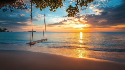 Poster - A tranquil beach scene with a swing facing the ocean at sunset, capturing the essence of relaxation and serenity.
