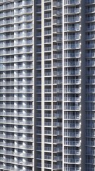 Poster - Tall building facade with detailed architectural elements in a realistic setting featuring copy space for text