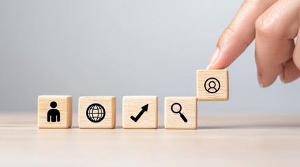 Poster - A hand places a block with a user icon onto a series of blocks featuring symbols representing growth, search, and global connectivity.