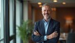 © miss irine - Middle aged businessman portrait, arms crossed in office. Confident pro executive in modern suit. Successful company chairman, happy investor, grey hair, beard, blue shirt, career success,