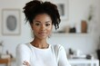 © Nirmal - a beautiful black woman posing with arms crossed.
