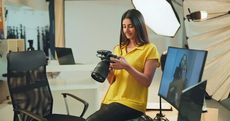 Poster - Photography, camera and check with woman in studio for production, creative director or editor. Photoshoot, branding campaign and backstage project with person for catalog and behind the scenes
