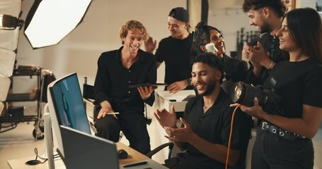 Poster - Photography, monitor and applause with people in studio for success, creative director and backstage process. Magazine approval, photoshoot and catalog support with team on set for media project
