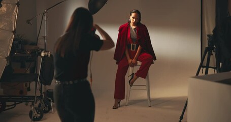 Poster - Photographer, fashion and model with people in studio for production, backstage and magazine campaign. Photoshoot, behind the scenes and creative director with women on set for branding process