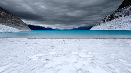 Aufkleber - Snowy landscape with a turquoise lake and dramatic clouds overhead