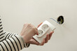 © triocean - Electrical Outlet Repairing and Assembling - home improvement concepts. Master electrician installs a socket in the house. DIY home project.