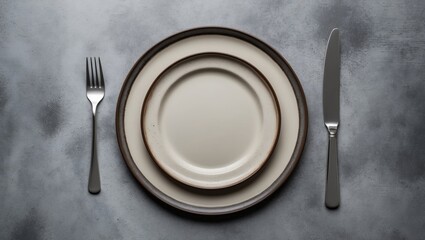 Poster - Empty plates and forks arranged on a grey concrete background. Aerial view. Mockup concept.