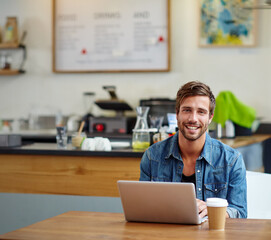 Fototapete - Business, man and portrait with laptop in coffee shop for online article, freelancing or creative process. Remote work, journalist and happy in restaurant for blog research, proofreading and browsing
